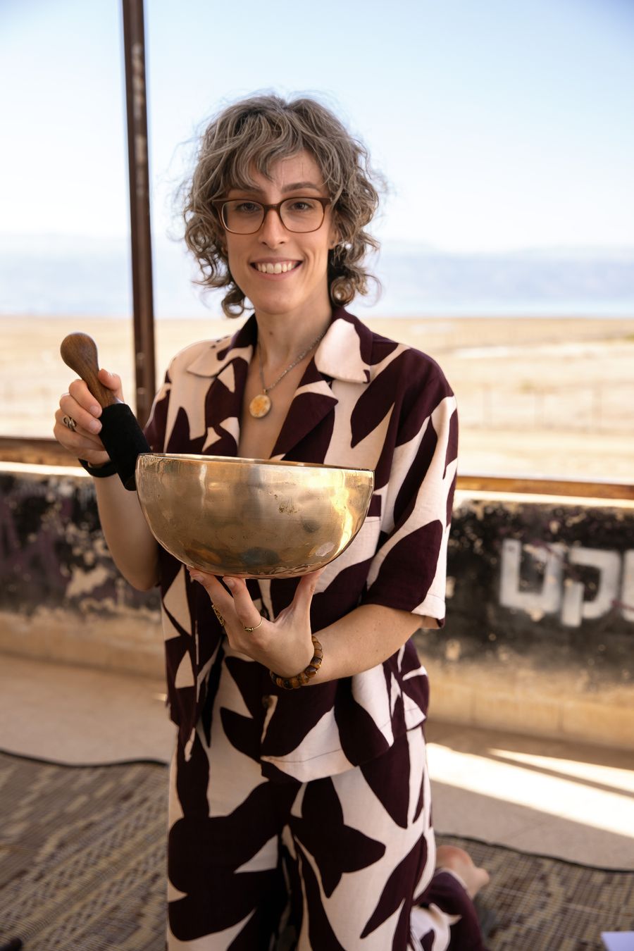 Zahara Holzer holding a Tibetan singing bowl